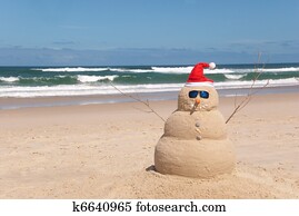 Sandman On Beach With Santa Hat And Sunglasses