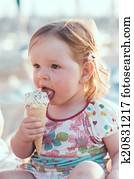 Little girl eating ice-cream