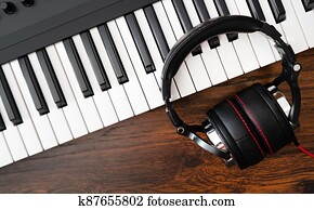 Piano and headphones. Recording studio concept.