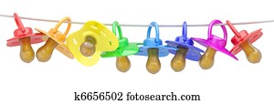 Row of babies dummies on rope. Row of babies dummies on rope.