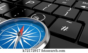 Compass lying on computer keyboard Compass lying on computer keyboard