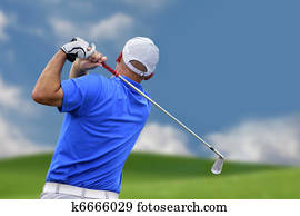 golfer shooting a golf ball