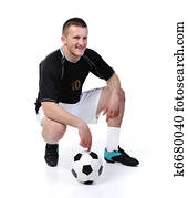 Football player is holding ball isolated on white