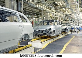 cars in a row at car plant