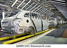 cars in a row at car plant cars in a row at car plant