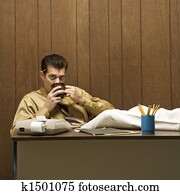 Man drinking coffee.