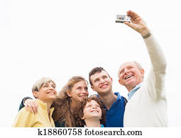 Smiling family taking photos