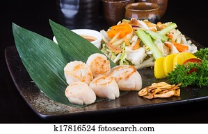 japanese cuisine. grilled shell fish on the background