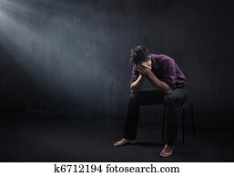 Sad man in a empty room