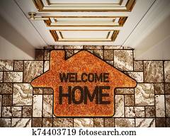 Welcome home doormat standing on the ground. 3D illustration Welcome home doormat standing on the ground. 3D illustration