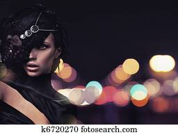 Fashion lady over city background Fashion lady over city background