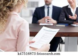 Woman holding her resume