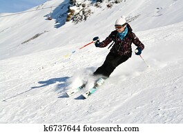 Woman is skiing at a ski resort Woman is skiing at a ski resort