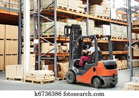 worker driver at warehouse forklift loader works