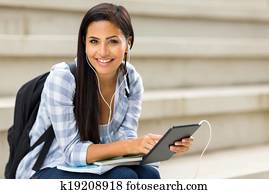 college student holding tablet computer