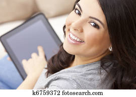 Happy Hispanic Woman Using Tablet Computer or iPad