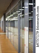 Wall with glass partitions and doors in office building