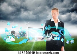 Blonde businesswoman touching lapto