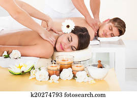 Couple Receiving Massage At Spa