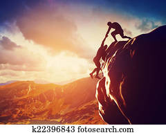 Hikers climbing on rock, mountain Hikers climbing on rock, mountain