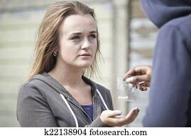 Teenage Girl Buying Drugs On The Street From Dealer Teenage Girl Buying Drugs On The Street From Dealer