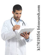 Arab doctor man reading a medical history