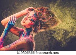 Young woman muse with creative body art and hairdo Young woman muse with creative body art and hairdo