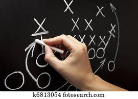 Man drawing a game strategy Man drawing a game strategy