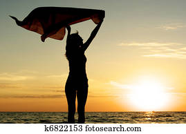 Girl with kerchief on the sunset