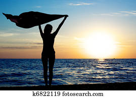 Girl with kerchief on the sunset