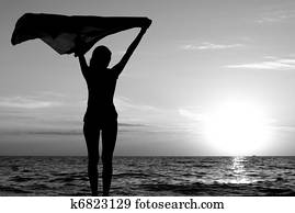 Girl with kerchief on the sunset