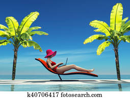 Woman in swimsuit using a laptop