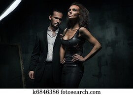 An attractive couple on the dark background