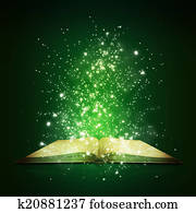 Old open book with magic light and falling stars Old open book with magic light and falling stars