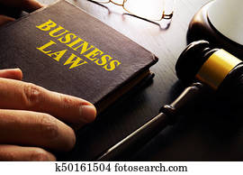 Business law and gavel on a table. Business law and gavel on a table.