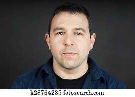 Man with neutral expression