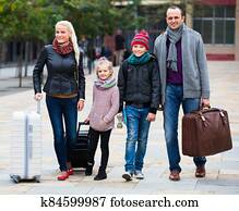 Parents with two kids chasing streets Parents with two kids chasing streets