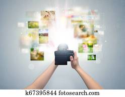 Hand captures life events with digital camera