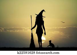 witch silhouette at sunset witch silhouette at sunset