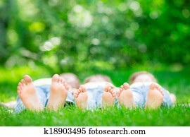 Family lying on grass