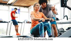 Personal trainer helping Personal trainer helping