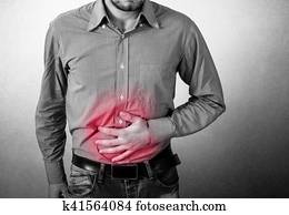 Man has a stomach pain Man has a stomach pain