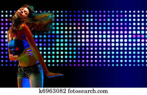 Beautiful young woman dancing in the nightclub