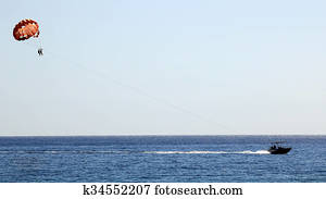 Couple parasailing on the Aegean sea
