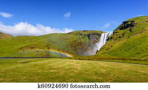Skogafoss waterfall with rainbow, Iceland