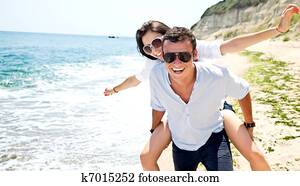 Young couple enjoing beach