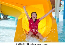 Happy girl on waterslide 