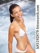 Bikini woman happy getting out of water Bikini woman happy getting out of water