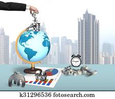 Human hand taking money symbols on terrestrial globe