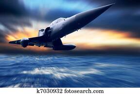 Military airplane low over the sea